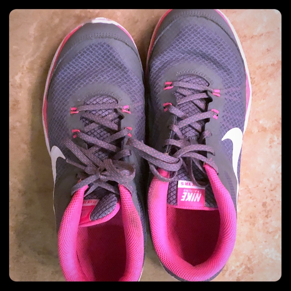 Pink and gray Nike running shoes
